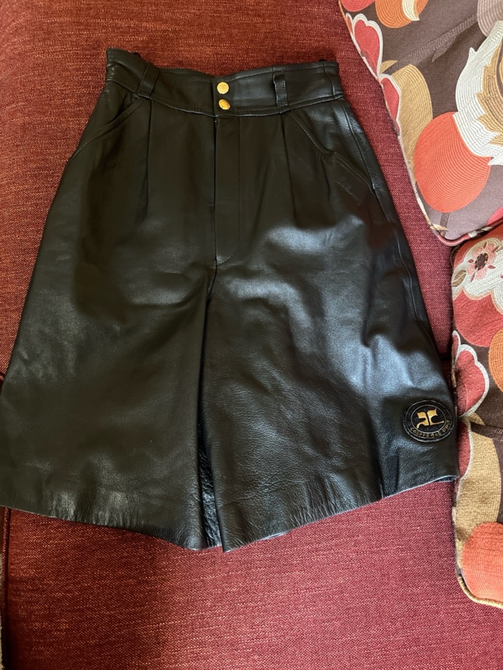 Couregges Black Leather High-Waist Shorts with Gold Button Detail